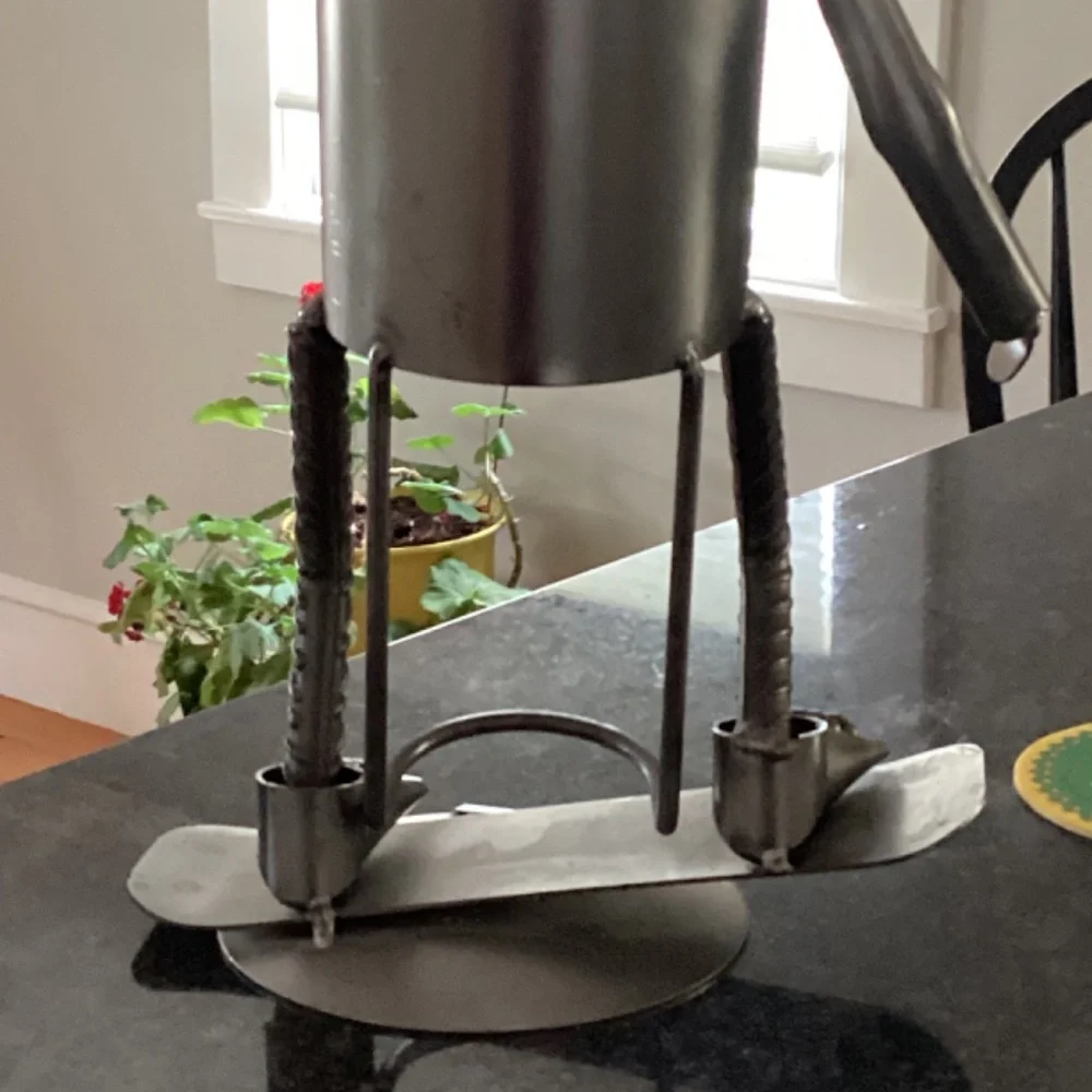 Wine bottle holder H & K steel on person on Skateboard?